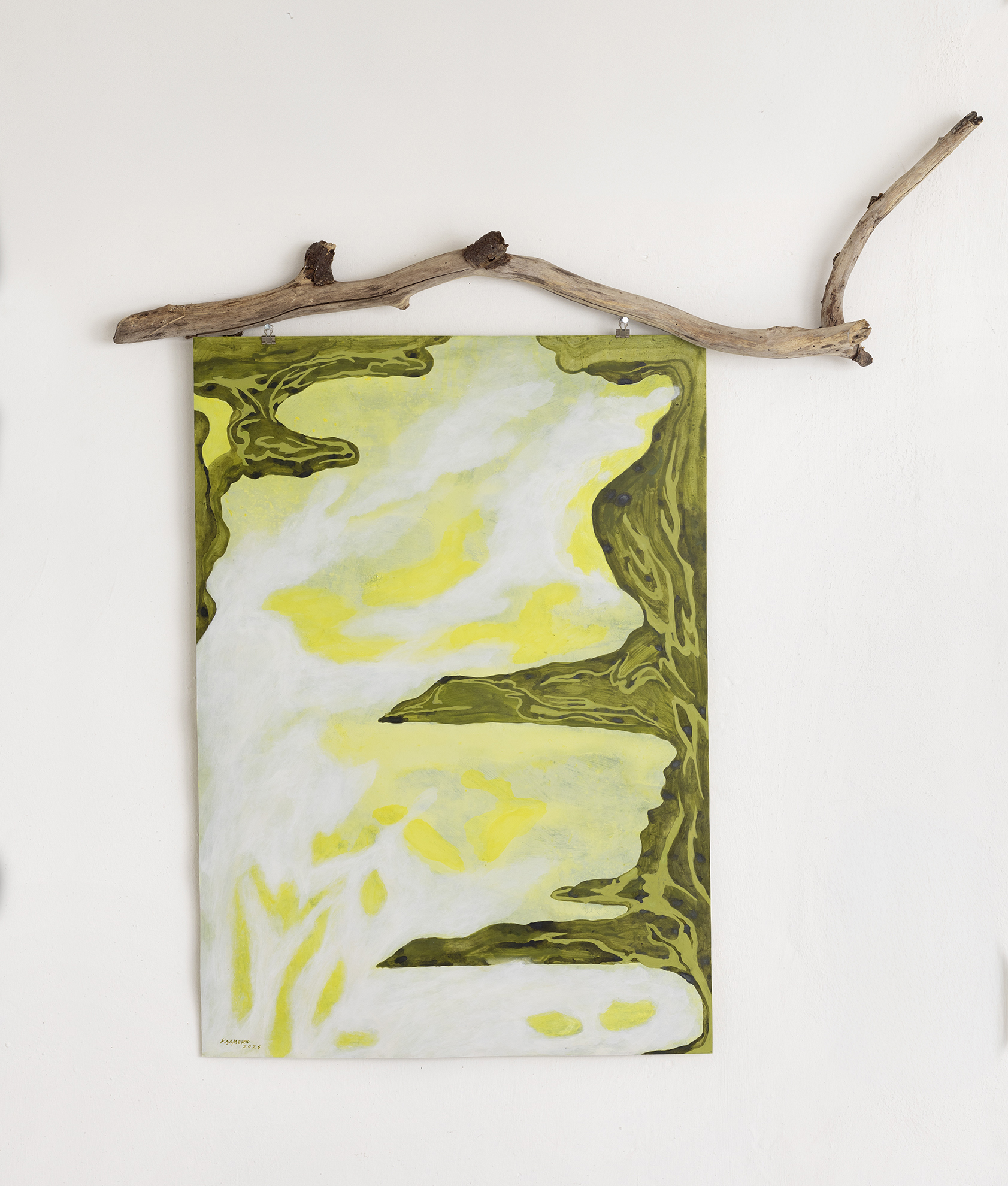 Closeup of a painting with limegreen nuances and a bright, natural stick on top