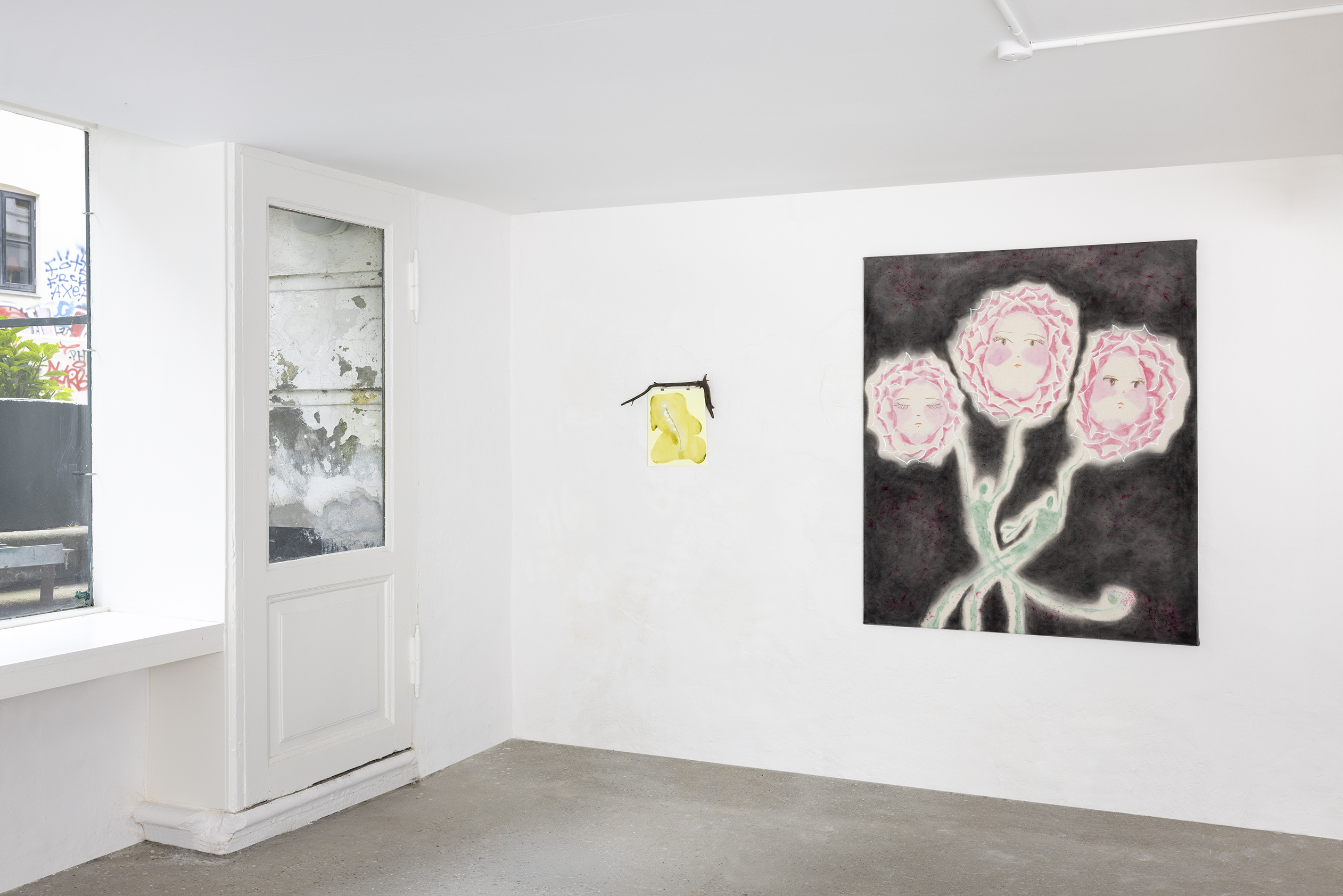 A piece by Kaja next to another artist's piece